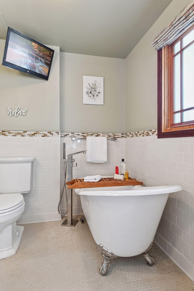 4011 Grimes Ave S, Edina, MN 55416 - full bath with tile walls, a soaking tub, tile patterned flooring, and a wainscoted wall