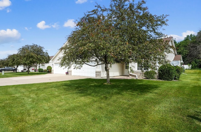 343 Tuttle Dr, Hastings, MN 55033 - view of property hidden behind natural elements featuring driveway, an attached garage, and a front lawn