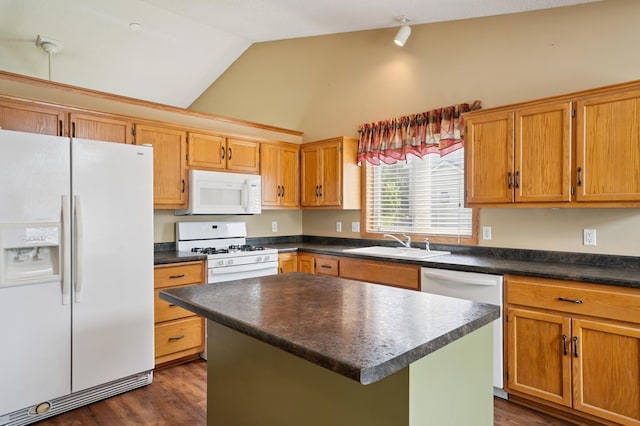 343 Tuttle Dr, Hastings, MN 55033 - kitchen featuring white appliances, lofted ceiling, dark countertops, dark wood finished floors, and a kitchen island