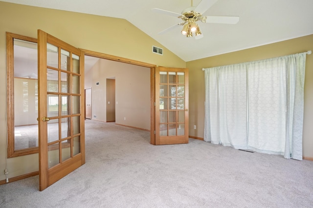 343 Tuttle Dr, Hastings, MN 55033 - carpeted empty room featuring french doors, ceiling fan, and high vaulted ceiling
