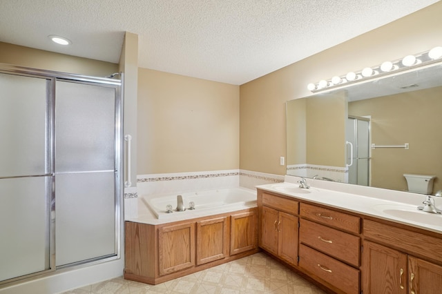 343 Tuttle Dr, Hastings, MN 55033 - bathroom with a stall shower, double vanity, a bath, a textured ceiling, and tile patterned floors