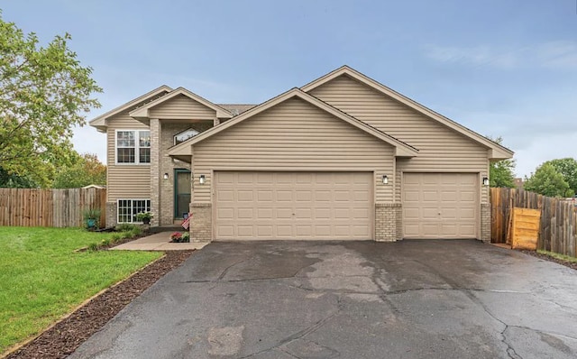 14617 Zilla St NW, Andover, MN 55304 - view of front of home with brick siding, driveway, and a garage