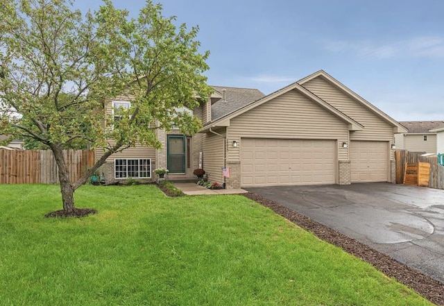 14617 Zilla St NW, Andover, MN 55304 - view of front of property featuring brick siding, asphalt driveway, a garage, and roof with shingles