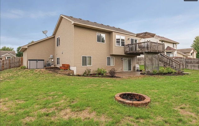 14617 Zilla St NW, Andover, MN 55304 - back of house with a fire pit, a deck, stairs, and a fenced backyard