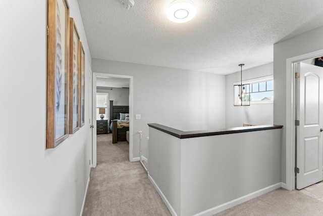 1174 139th St E, Rosemount, MN 55068 - corridor featuring an upstairs landing, light carpet, and a textured ceiling