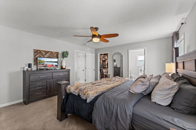 1174 139th St E, Rosemount, MN 55068 - bedroom with light carpet, a spacious closet, arched walkways, a closet, and ensuite bath