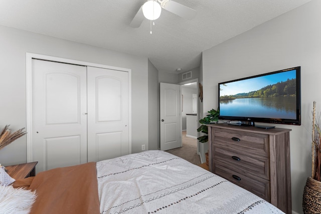 1174 139th St E, Rosemount, MN 55068 - bedroom featuring a closet, ceiling fan, and a textured ceiling