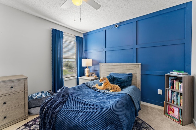 1174 139th St E, Rosemount, MN 55068 - bedroom featuring carpet, a decorative wall, a textured ceiling, and ceiling fan