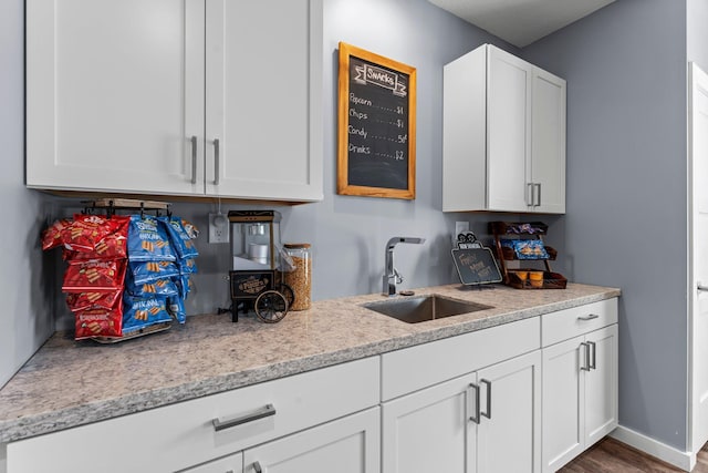 1174 139th St E, Rosemount, MN 55068 - kitchen featuring white cabinets and wood finished floors