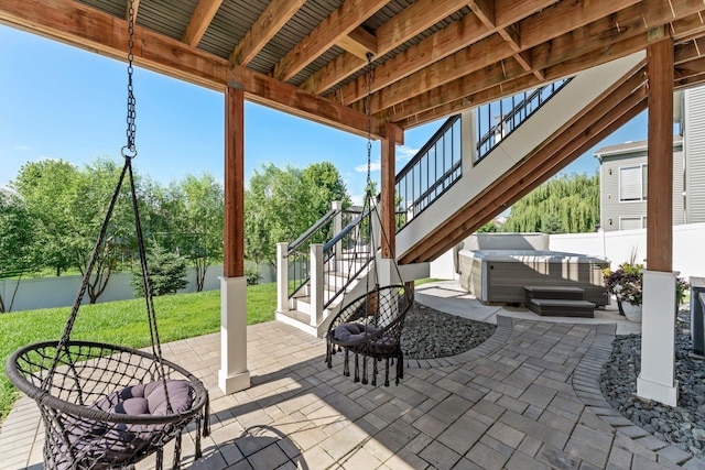 1174 139th St E, Rosemount, MN 55068 - fenced backyard with a hot tub, stairs, and a patio area