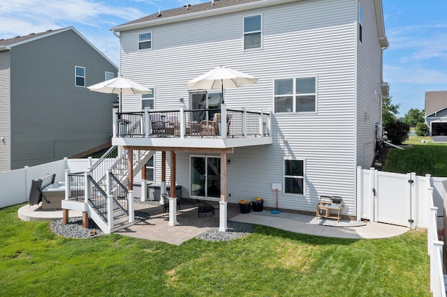1174 139th St E, Rosemount, MN 55068 - back of property with a gate, a patio area, a wooden deck, and stairway