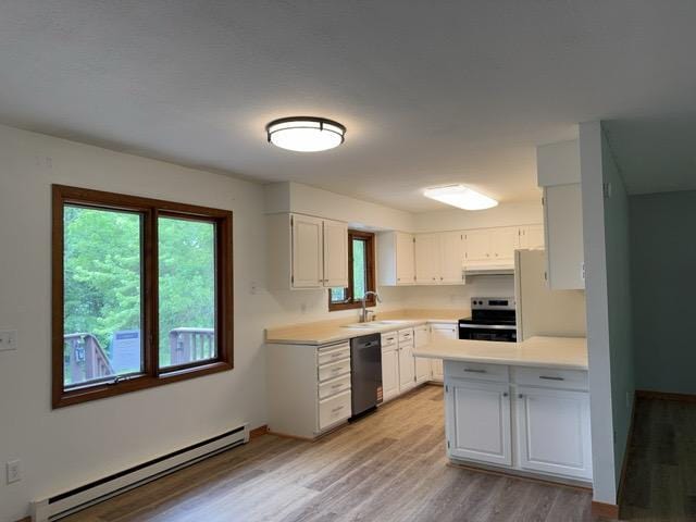 240 12th Ave, Grand Rapids, MN 55744 - kitchen featuring baseboard heating, stainless steel electric range oven, black dishwasher, light wood finished floors, and light countertops