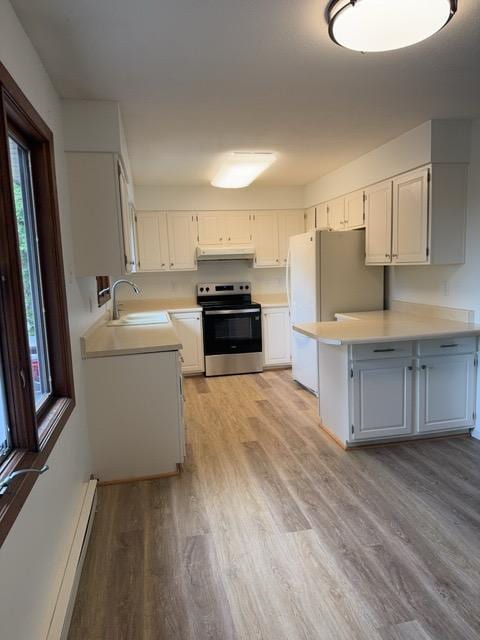 240 12th Ave, Grand Rapids, MN 55744 - kitchen with stainless steel electric range oven, plenty of natural light, a baseboard radiator, and light countertops