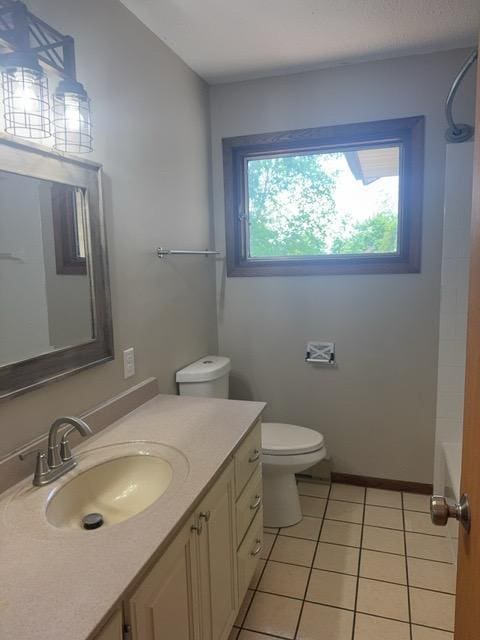 240 12th Ave, Grand Rapids, MN 55744 - full bath featuring vanity, tile patterned floors, and shower / tub combination