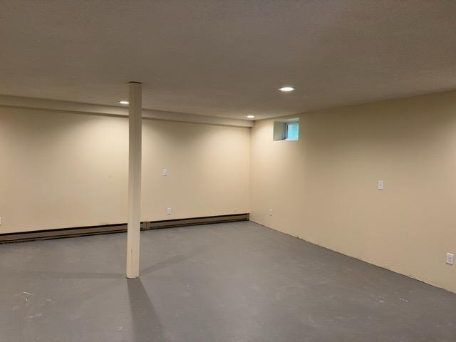 240 12th Ave, Grand Rapids, MN 55744 - basement featuring recessed lighting and a baseboard radiator