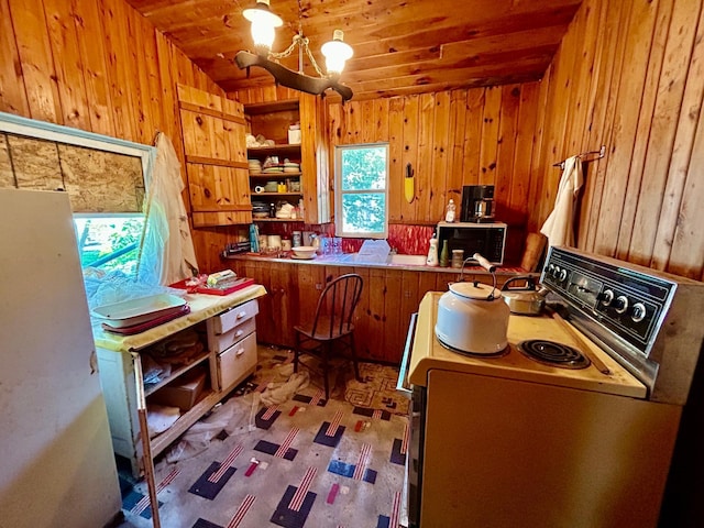 44493 Nitche Lake Rd, Pine Lake Twp, MN 56573 - kitchen featuring white electric stove, wood walls, a chandelier, brown cabinets, and open shelves