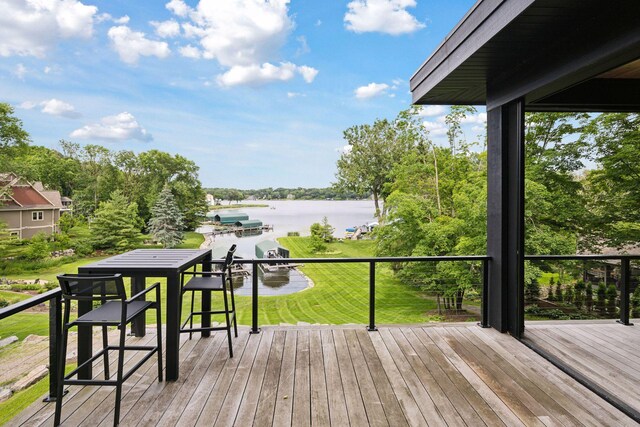 1300 Wildhurst Trl, Orono, MN 55364 - wooden deck featuring a water view, view of wooded area, and a yard