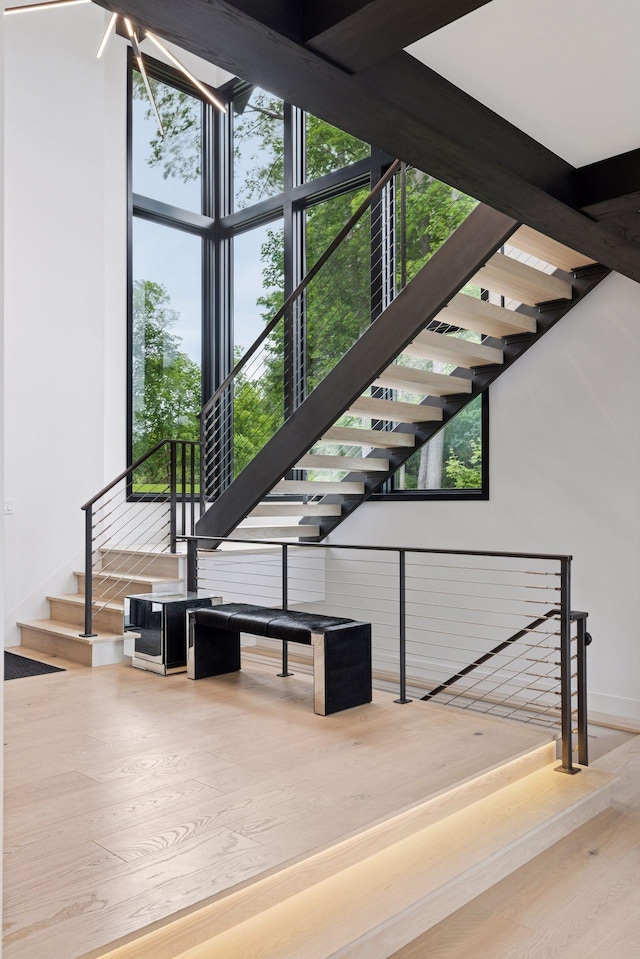 1300 Wildhurst Trl, Orono, MN 55364 - stairs featuring wood finished floors