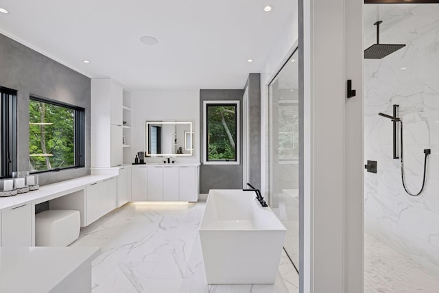 1300 Wildhurst Trl, Orono, MN 55364 - full bath with marble tiled floors, a freestanding tub, a marble finish shower, vanity, and recessed lighting