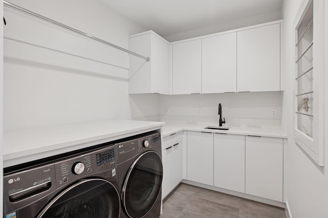 1300 Wildhurst Trl, Orono, MN 55364 - washroom with cabinet space and independent washer and dryer