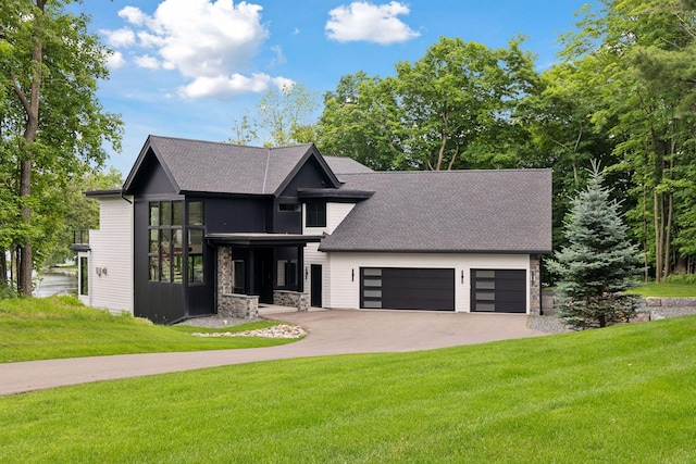 1300 Wildhurst Trl, Orono, MN 55364 - view of front of house with stone siding, concrete driveway, a front lawn, and a garage
