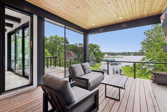 1300 Wildhurst Trl, Orono, MN 55364 - deck with a water view, an outdoor hangout area, and view of wooded area