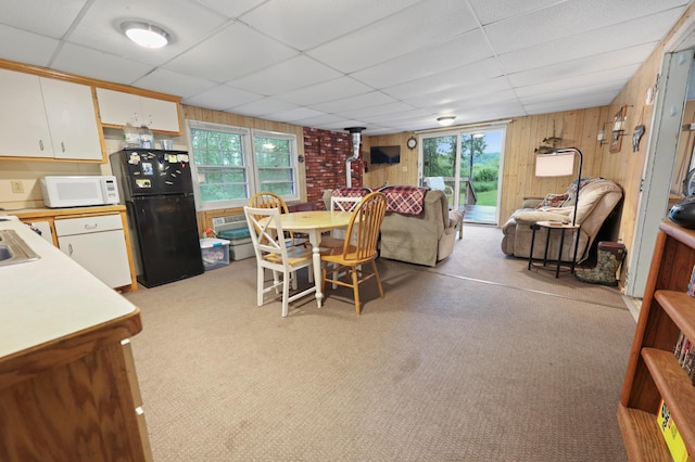 14364 Hummingbird Trl, Bay Lake Twp, MN 56444 - dining room with wooden walls, a drop ceiling, and light colored carpet