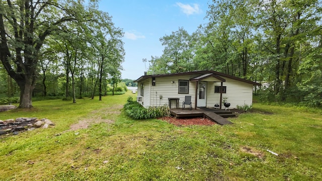 14364 Hummingbird Trl, Bay Lake Twp, MN 56444 - rear view of property with a yard and a wooden deck