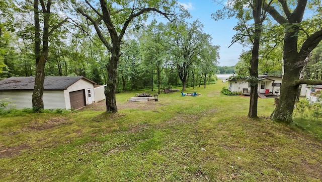 14364 Hummingbird Trl, Bay Lake Twp, MN 56444 - view of grassy yard featuring an outbuilding and a detached garage