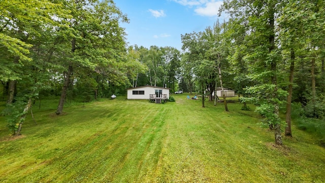 14364 Hummingbird Trl, Bay Lake Twp, MN 56444 - view of grassy yard featuring an outbuilding