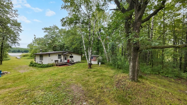 14364 Hummingbird Trl, Bay Lake Twp, MN 56444 - view of grassy yard featuring a wooden deck