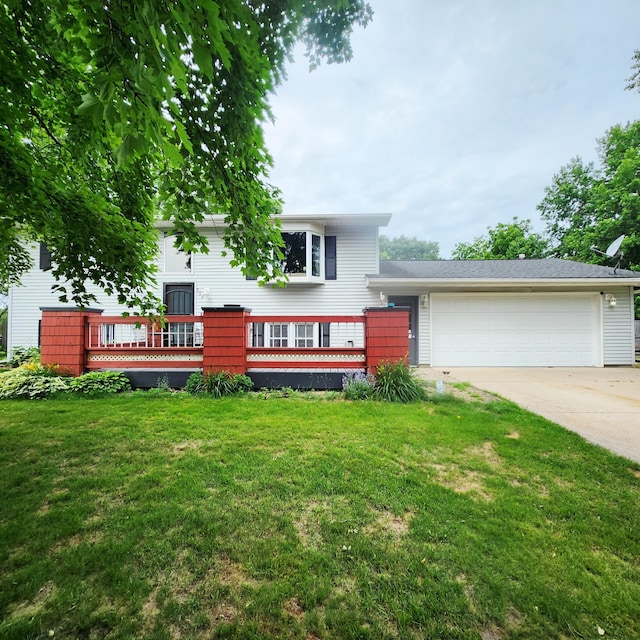 306 Parkview Curv, Zumbrota, MN 55992 - split level home with driveway, an attached garage, and a front yard