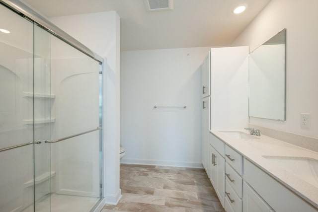 6266 205th St N, Forest Lake, MN 55025 - full bathroom with double vanity, a shower stall, and recessed lighting