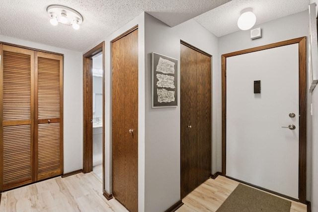 1200 Nicollet Mall Unit 409, Minneapolis, MN 55403 - entrance foyer featuring a textured ceiling and light wood-style flooring