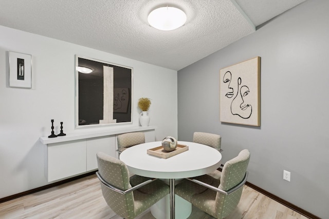 1200 Nicollet Mall Unit 409, Minneapolis, MN 55403 - dining area featuring light wood finished floors and a textured ceiling