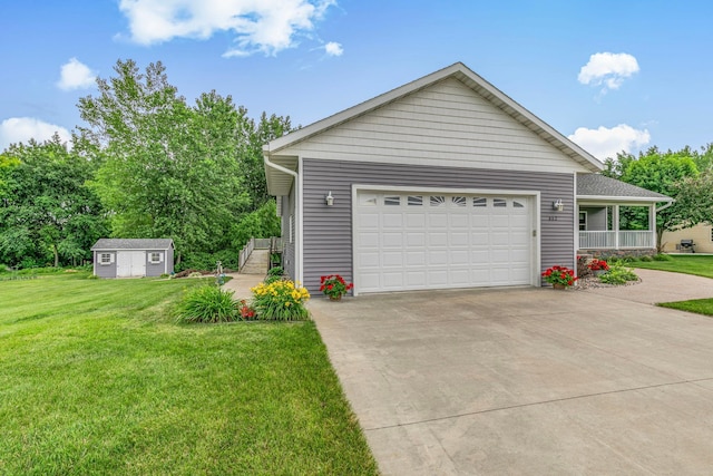662 Cottonwood Ave, Litchfield, MN 55355 - view of front facade with a front yard, driveway, a garage, and an outdoor structure