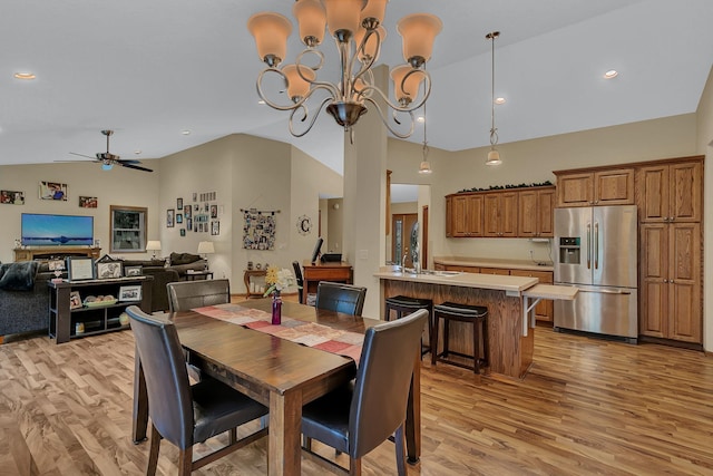 662 Cottonwood Ave, Litchfield, MN 55355 - dining area featuring lofted ceiling, light wood-style floors, ceiling fan, a chandelier, and recessed lighting