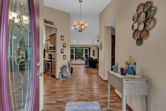 662 Cottonwood Ave, Litchfield, MN 55355 - entrance foyer with a chandelier and wood finished floors