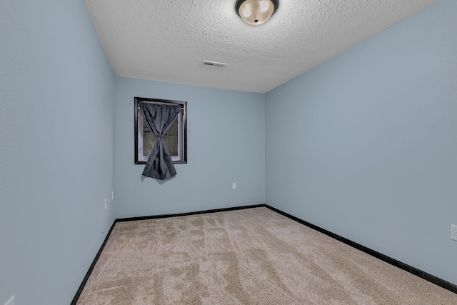 662 Cottonwood Ave, Litchfield, MN 55355 - unfurnished room featuring carpet and a textured ceiling