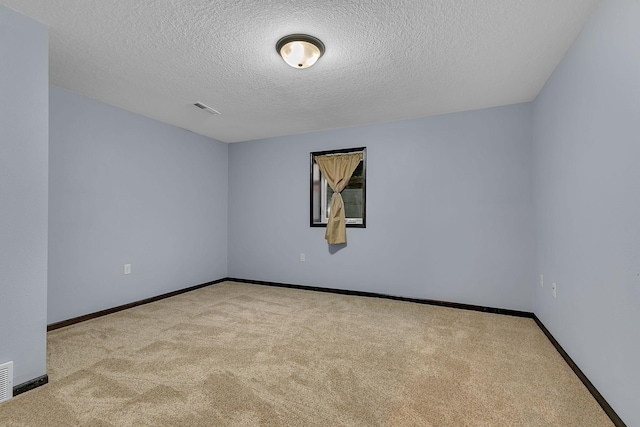 662 Cottonwood Ave, Litchfield, MN 55355 - unfurnished room featuring carpet floors and a textured ceiling