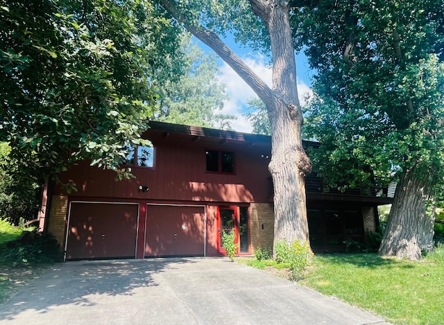 626 Desnoyer Ave, Saint Paul, MN 55104 - view of front of home featuring brick siding, a garage, and driveway