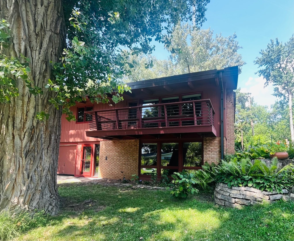 626 Desnoyer Ave, Saint Paul, MN 55104 - rear view of property featuring brick siding, a yard, and a wooden deck