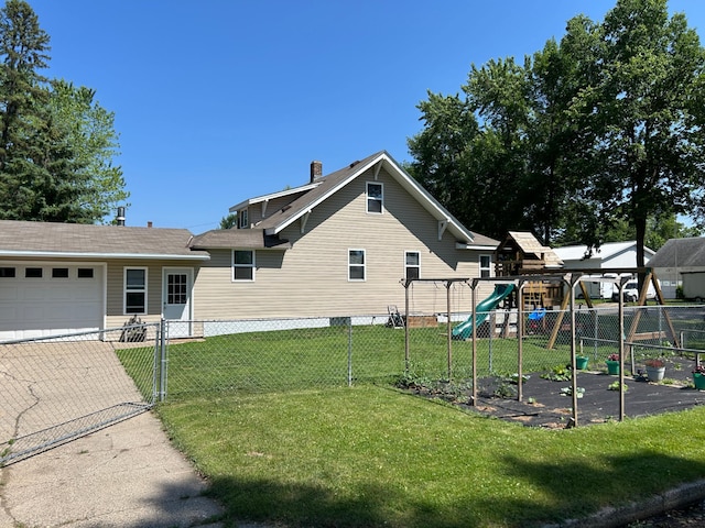20 King Ave SW, Wadena, MN 56482 - view of side of home with a playground, a garage, and a chimney