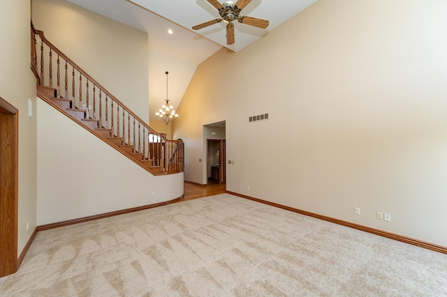 1608 Greystone Ln SW, Rochester, MN 55902 - unfurnished living room with stairs, carpet, a ceiling fan, a chandelier, and recessed lighting
