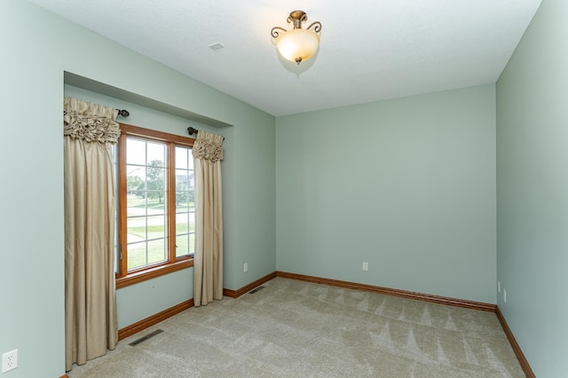 1608 Greystone Ln SW, Rochester, MN 55902 - spare room with light carpet and baseboards