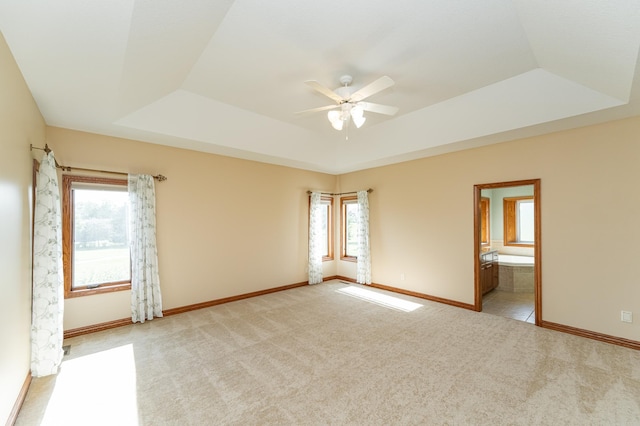1608 Greystone Ln SW, Rochester, MN 55902 - spare room with a raised ceiling, ceiling fan, plenty of natural light, and carpet floors