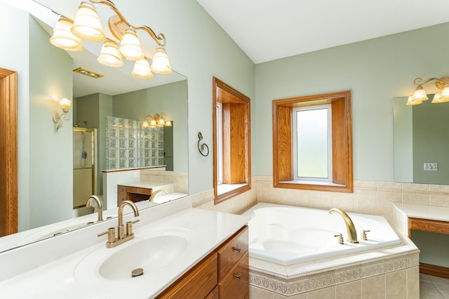 1608 Greystone Ln SW, Rochester, MN 55902 - full bathroom featuring vanity, a stall shower, a bath, a chandelier, and tile patterned floors