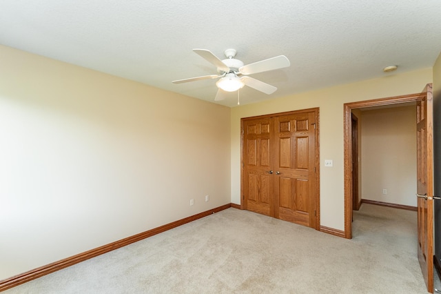 1608 Greystone Ln SW, Rochester, MN 55902 - unfurnished bedroom featuring light colored carpet, a closet, and ceiling fan
