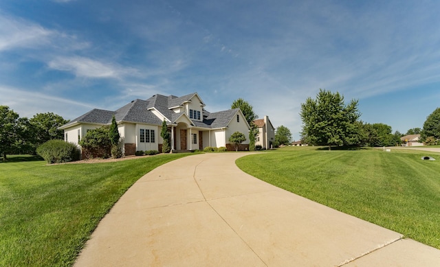 1608 Greystone Ln SW, Rochester, MN 55902 - view of front of property featuring concrete driveway, a front lawn, and a garage