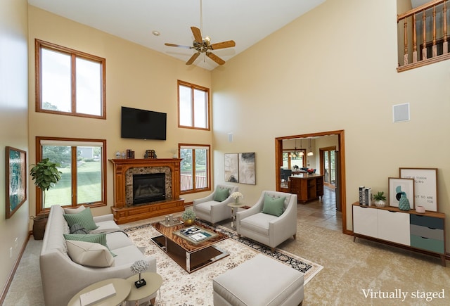 1608 Greystone Ln SW, Rochester, MN 55902 - living room featuring high vaulted ceiling, a high end fireplace, plenty of natural light, and a ceiling fan